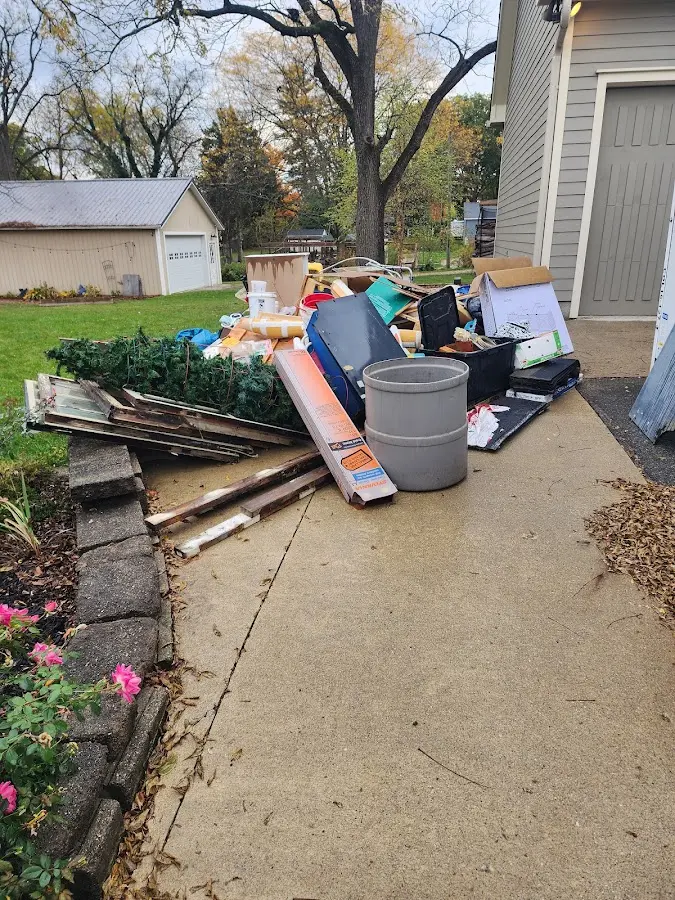 Dumpster being loaded with debris for 10 Yard Dumpster Rental in Westminster